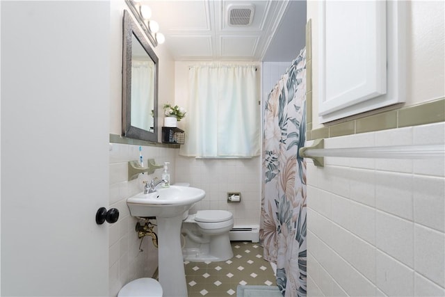 207 County Road 7, Manchester, NY 14432 - bathroom featuring tile walls, baseboard heating, a shower with shower curtain, and tile patterned flooring