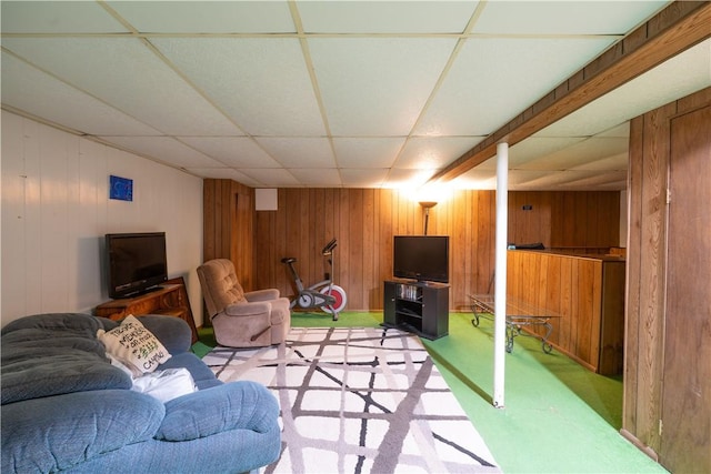 207 County Road 7, Manchester, NY 14432 - living area featuring light colored carpet, a paneled ceiling, and wood walls