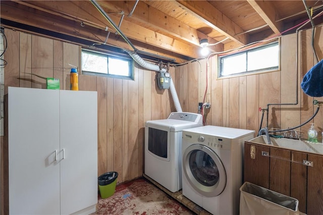 207 County Road 7, Manchester, NY 14432 - laundry room featuring washer and dryer, wood walls, and healthy amount of natural light
