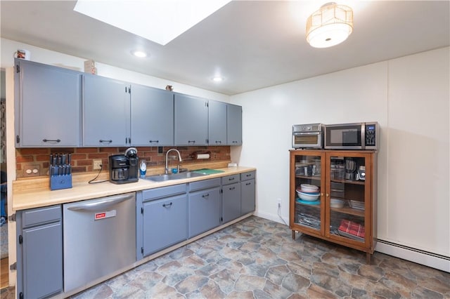 207 County Road 7, Manchester, NY 14432 - kitchen with stainless steel appliances, stone finish floors, a baseboard radiator, blue cabinets, and backsplash