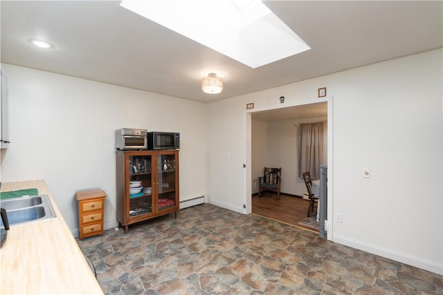 207 County Road 7, Manchester, NY 14432 - office area with a baseboard radiator, a skylight, and stone finish floors