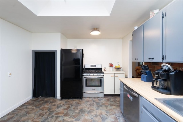 207 County Road 7, Manchester, NY 14432 - kitchen with stainless steel appliances, light countertops, stone finish flooring, and tasteful backsplash
