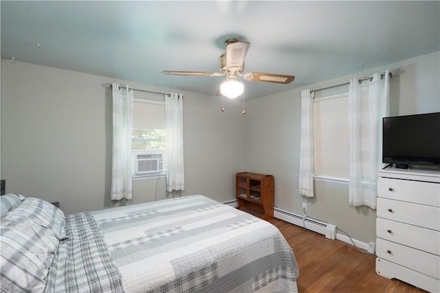 207 County Road 7, Manchester, NY 14432 - bedroom featuring a baseboard heating unit, cooling unit, wood finished floors, and ceiling fan