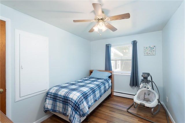 207 County Road 7, Manchester, NY 14432 - bedroom with baseboard heating, wood finished floors, and ceiling fan