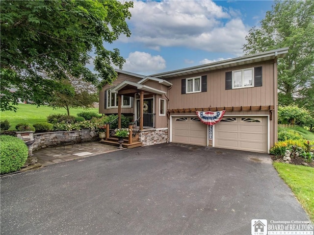4627 Anderson Dr, Ellery, NY 14712 - bi-level home with driveway, a garage, and stone siding