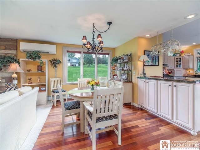 4627 Anderson Dr, Ellery, NY 14712 - dining area with a wall mounted air conditioner, a chandelier, light wood-type flooring, and recessed lighting