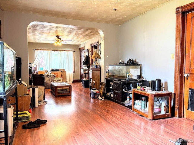 134 Hamburg St, Buffalo, NY 14204 - living area featuring arched walkways, wood finished floors, and ceiling fan