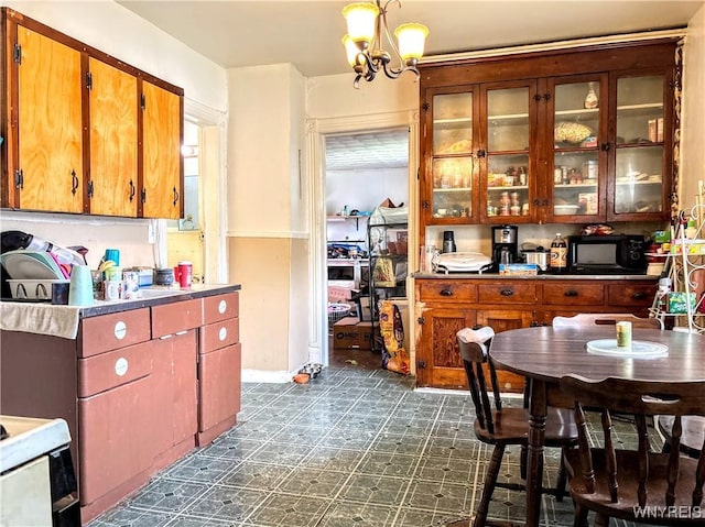 134 Hamburg St, Buffalo, NY 14204 - dining room with dark floors and a chandelier