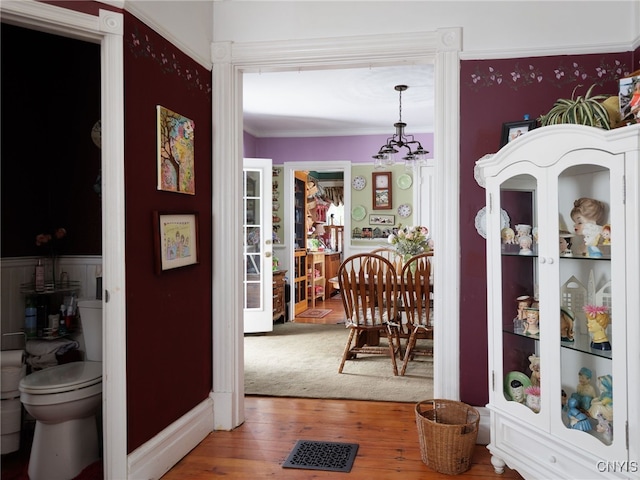 303 Mullin St, Watertown-City, NY 13601 - hall with wood finished floors and ornamental molding