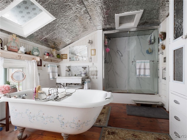 303 Mullin St, Watertown-City, NY 13601 - full bathroom featuring an ornate ceiling, wood finished floors, a marble finish shower, a freestanding tub, and ornamental molding