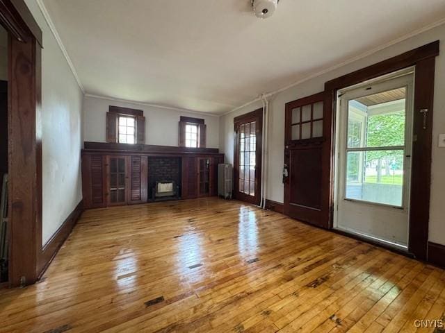 15 Broadway Ave, Cortland, NY 13045 - entryway featuring ornamental molding, hardwood / wood-style flooring, and a fireplace