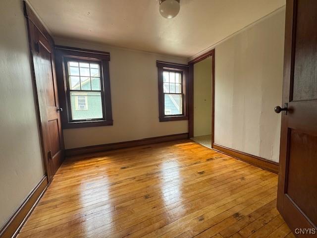 15 Broadway Ave, Cortland, NY 13045 - unfurnished room featuring light wood-style flooring and plenty of natural light