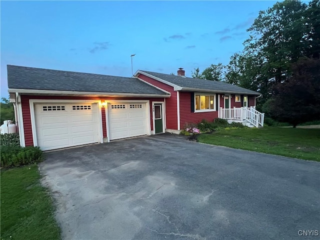 412 County Route 62, Sandy Creek, NY 13142 - ranch-style home with an attached garage, asphalt driveway, a chimney, a front yard, and roof with shingles