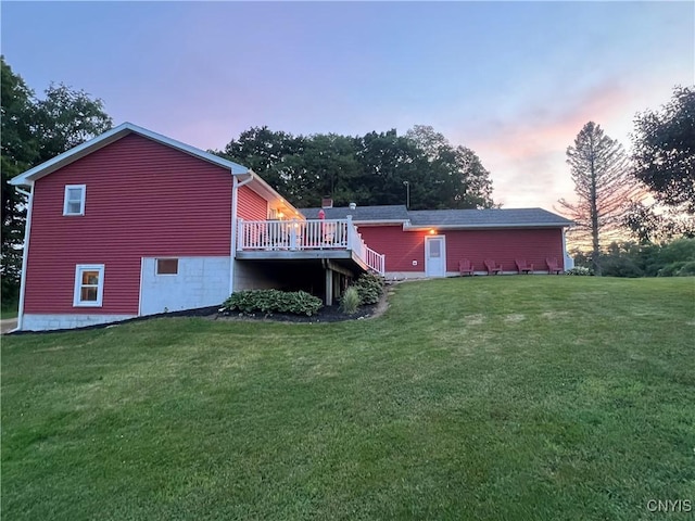 412 County Route 62, Sandy Creek, NY 13142 - back of property at dusk with a yard and a wooden deck