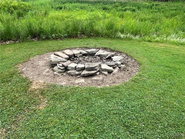 412 County Route 62, Sandy Creek, NY 13142 - view of green lawn with an outdoor fire pit