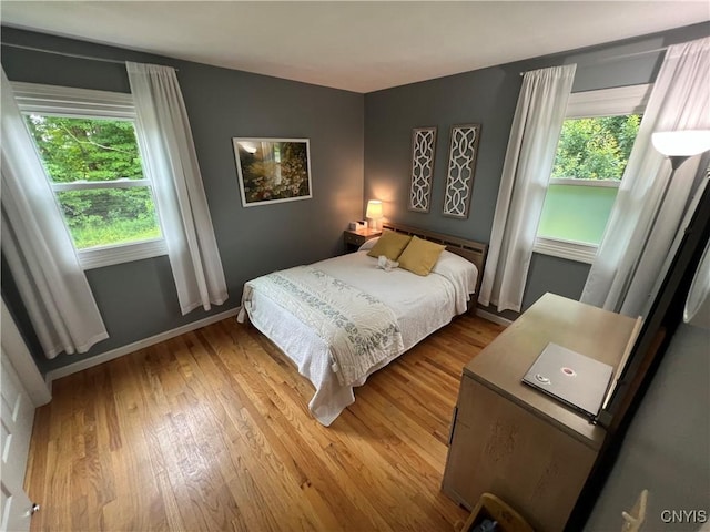 412 County Route 62, Sandy Creek, NY 13142 - bedroom featuring multiple windows and wood finished floors