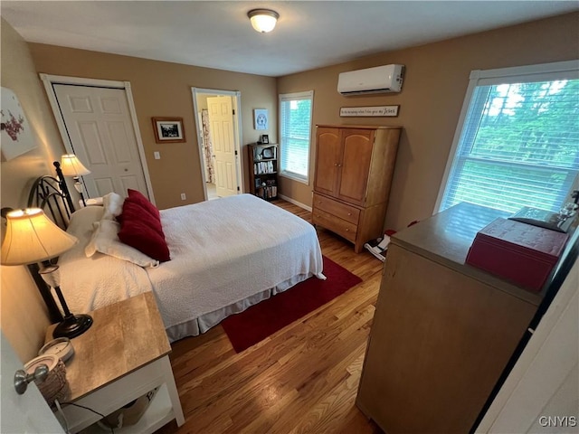 412 County Route 62, Sandy Creek, NY 13142 - bedroom featuring a wall mounted air conditioner and wood finished floors