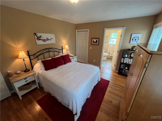 412 County Route 62, Sandy Creek, NY 13142 - bedroom featuring wood finished floors, ensuite bathroom, and a closet