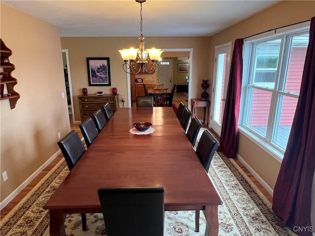412 County Route 62, Sandy Creek, NY 13142 - dining room featuring healthy amount of natural light, a chandelier, and wood finished floors