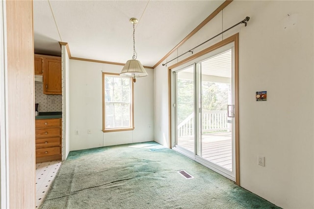 223 N Vine Valley Rd, Middlesex, NY 14544 - unfurnished dining area with light colored carpet and ornamental molding