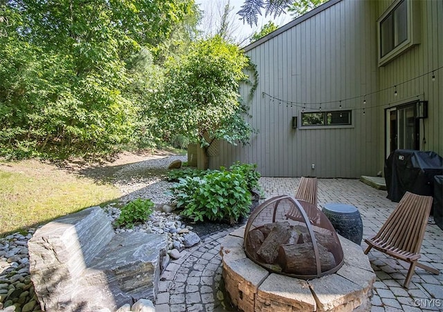 4458 E Lake Rd, Cazenovia, NY 13035 - view of patio featuring area for grilling and a fire pit
