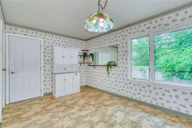 1541 Shoecraft Rd, Penfield, NY 14526 - unfurnished dining area featuring wallpapered walls, light flooring, and crown molding