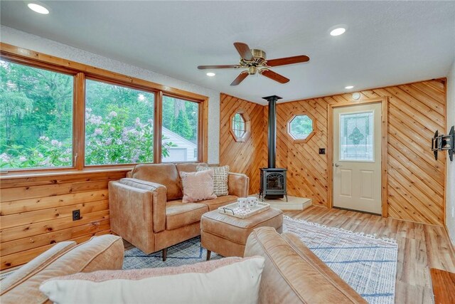 1541 Shoecraft Rd, Penfield, NY 14526 - living room with plenty of natural light, wood finished floors, a wood stove, ceiling fan, and recessed lighting
