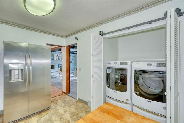 1541 Shoecraft Rd, Penfield, NY 14526 - laundry area with washing machine and clothes dryer and crown molding
