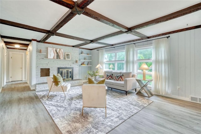 1541 Shoecraft Rd, Penfield, NY 14526 - living area with wood finished floors, coffered ceiling, beamed ceiling, and a brick fireplace