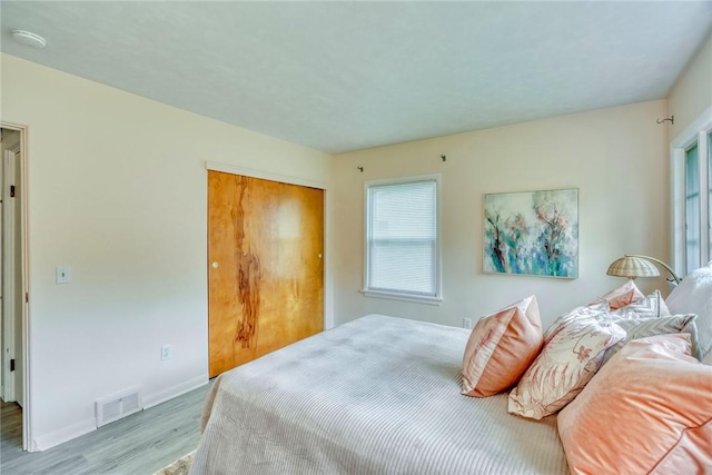 1541 Shoecraft Rd, Penfield, NY 14526 - bedroom featuring wood finished floors and a closet