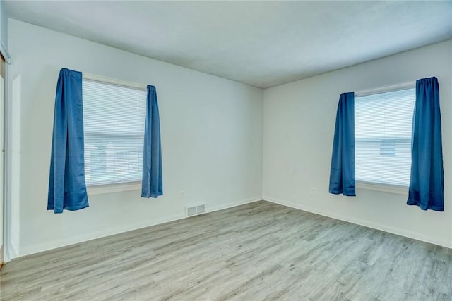 1541 Shoecraft Rd, Penfield, NY 14526 - unfurnished room featuring wood finished floors and plenty of natural light
