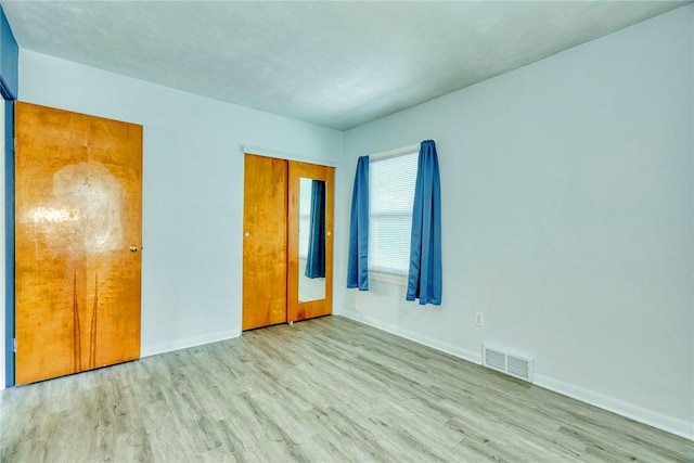 1541 Shoecraft Rd, Penfield, NY 14526 - unfurnished bedroom with wood finished floors and a closet