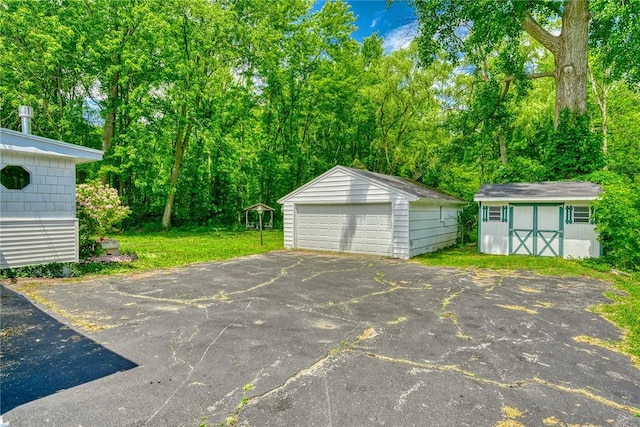 1541 Shoecraft Rd, Penfield, NY 14526 - view of vehicle parking with a detached garage