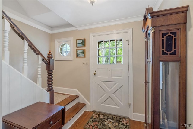 2 Morton Rd, Dewitt, NY 13214 - entryway featuring stairs, wood finished floors, and ornamental molding
