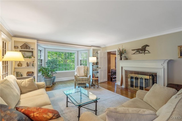 2 Morton Rd, Dewitt, NY 13214 - living room featuring ornamental molding, wood finished floors, and a brick fireplace