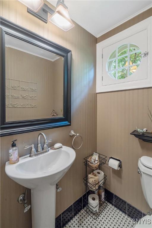 2 Morton Rd, Dewitt, NY 13214 - bathroom with ornamental molding, tile patterned floors, and wood walls
