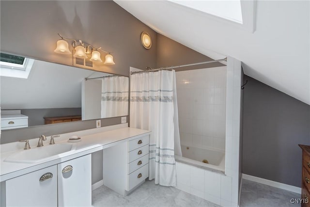 2 Morton Rd, Dewitt, NY 13214 - bathroom featuring a skylight, lofted ceiling, vanity, tiled shower / bath combo, and marble finish floors
