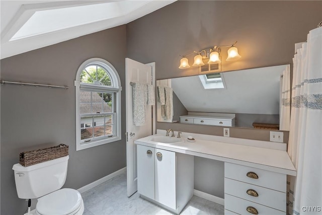 2 Morton Rd, Dewitt, NY 13214 - bathroom featuring a skylight, vaulted ceiling, and vanity