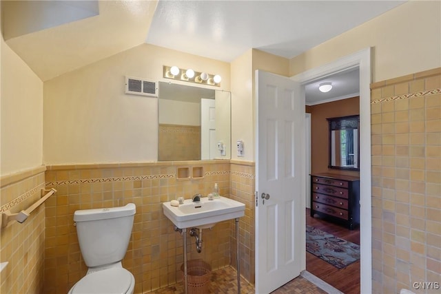 2 Morton Rd, Dewitt, NY 13214 - bathroom with tile walls, wood finished floors, and wainscoting