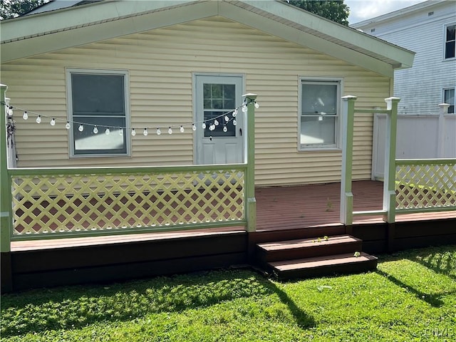 10 Montgomery St, Hamilton, NY 13346 - back of property featuring a deck and a yard