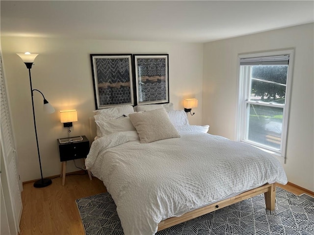 10 Montgomery St, Hamilton, NY 13346 - bedroom featuring wood finished floors and baseboards