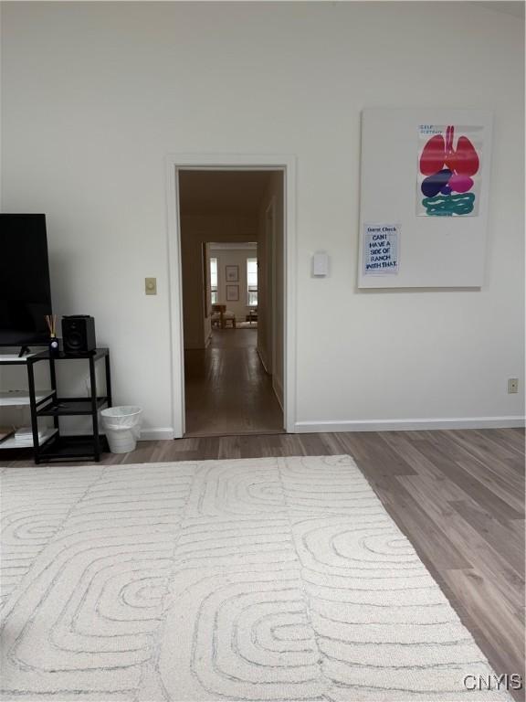 10 Montgomery St, Hamilton, NY 13346 - unfurnished bedroom featuring wood finished floors and baseboards