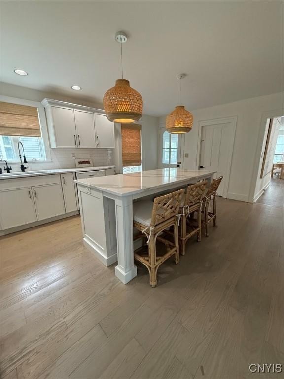 10 Montgomery St, Hamilton, NY 13346 - kitchen featuring plenty of natural light, light wood-style flooring, light countertops, and recessed lighting