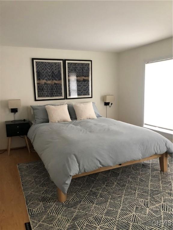 10 Montgomery St, Hamilton, NY 13346 - bedroom featuring wood finished floors