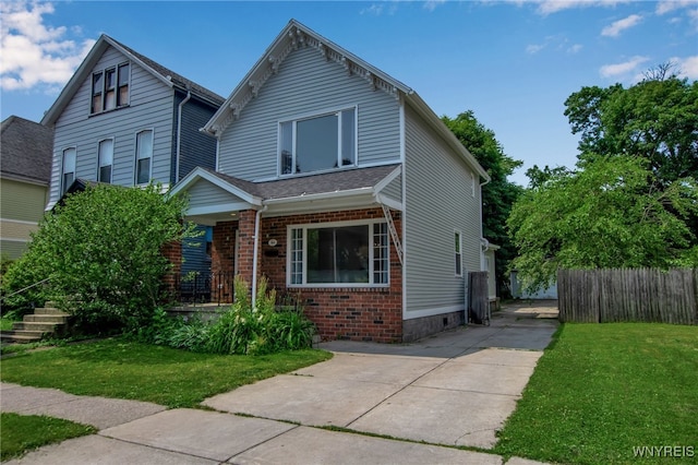 184 14th St, Buffalo, NY 14213 - view of front facade with brick siding and covered porch