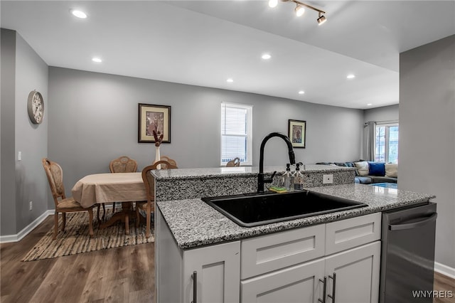 184 14th St, Buffalo, NY 14213 - kitchen featuring stainless steel dishwasher, dark wood-style flooring, recessed lighting, white cabinetry, and open floor plan