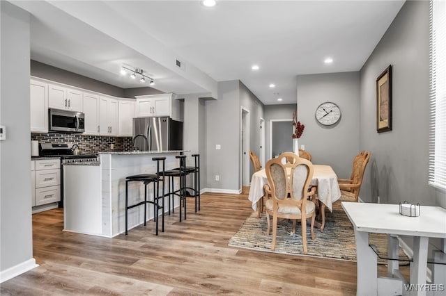 184 14th St, Buffalo, NY 14213 - dining space featuring light wood-style flooring and recessed lighting