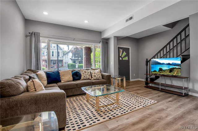 184 14th St, Buffalo, NY 14213 - living room with wood finished floors, recessed lighting, and stairway