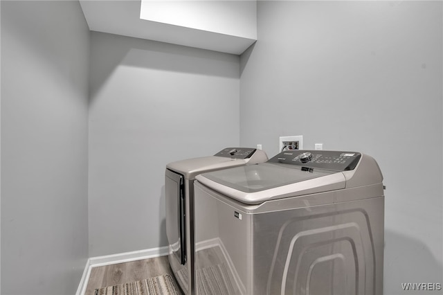 184 14th St, Buffalo, NY 14213 - washroom featuring washing machine and clothes dryer and wood finished floors