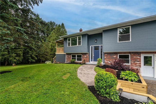 2540 Snyder Rd, Orangeville, NY 14167 - split foyer home with a front yard, brick siding, and a chimney